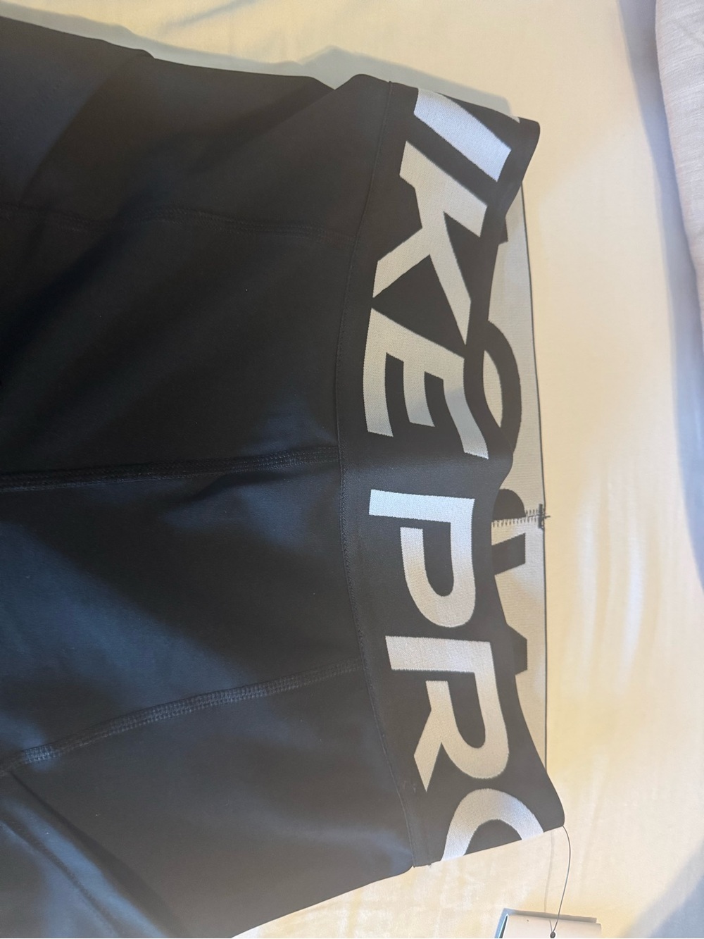 Nike Black Crop Sports Tank with White Swoosh and Branded Hem - Picture 3 of 4